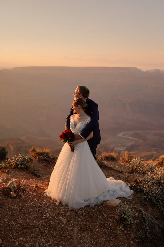 horseshoe bend wedding with couple looking at river sandstone classic bride