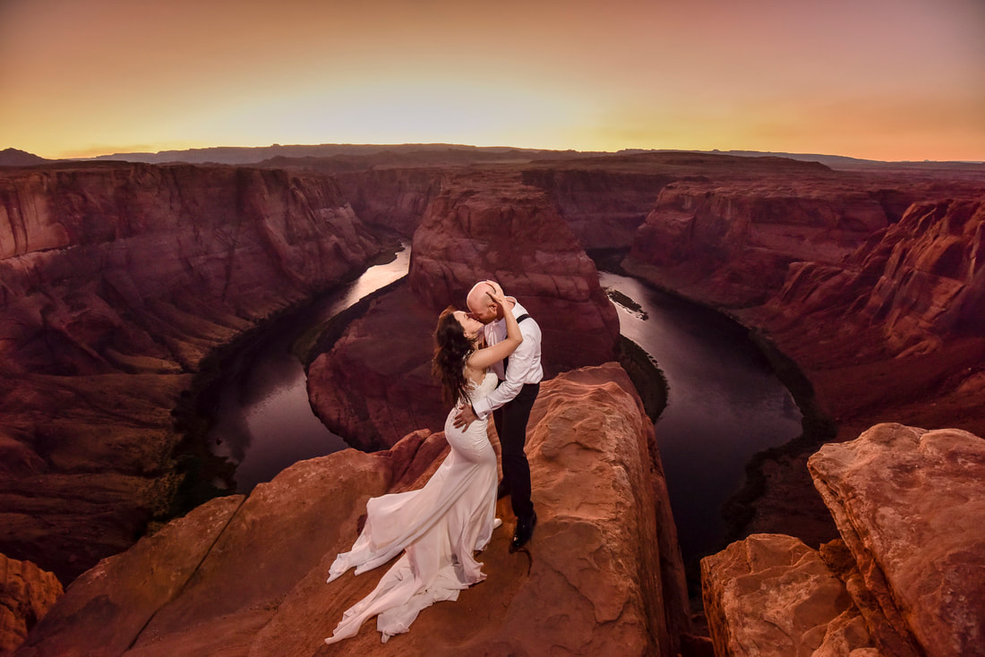 couple kissing sunset at horseshoe bend arizona destination elopement wedding photographer