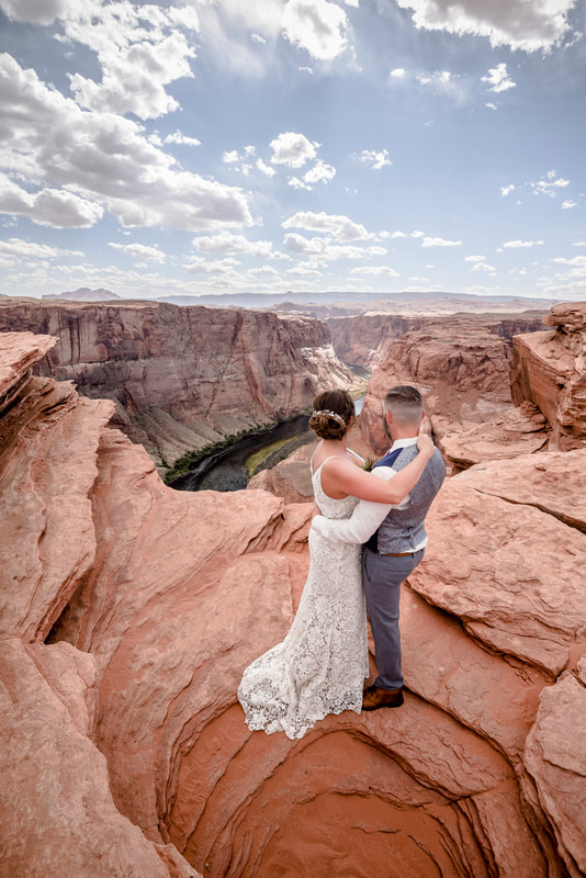 horseshoe bend wedding with couple looking at river sandstone classic bride