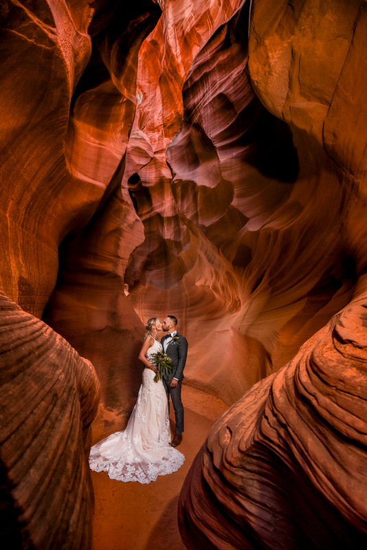 bride and groom kissing in antelope canyon with horseshoe bend slot canyon tours
